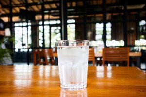 Glass Of Mineral Water On Wood Table In Restaurant 11184296